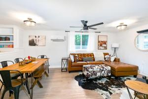 a living room with a couch and a table at East Nashville Nook Best of Both Worlds in Nashville