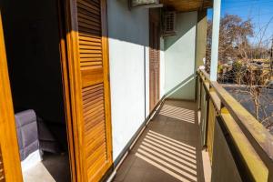 a wooden door on a porch of a house at Departamento Serena in San Juan