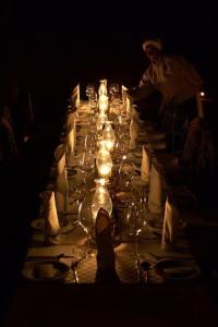 a long table with wine glasses on it at Mogalakwena River Lodge in Alldays