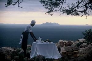 a person with a table on top of a mountain at Mogalakwena River Lodge in Alldays