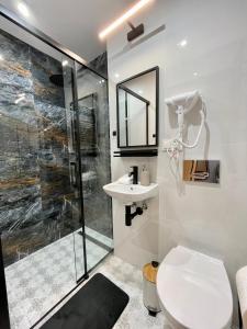 Kúpeľňa v ubytovaní Przytulne mieszkanie w centrum miasta + 10 fotografií
