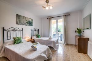 Postel nebo postele na pokoji v ubytování Ideal Property Mallorca - Villa Corb Mari + 37 fotografií