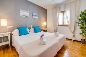 two beds in a room with blue and white at Ideal Property Mallorca - Es Claperas in Inca +37 photos