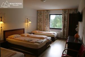 Un ou plusieurs lits dans un hébergement de l'établissement Biały Potok