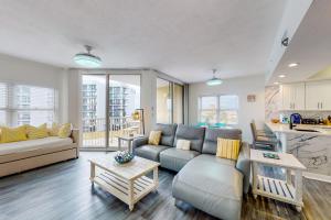 a living room with a couch and a table at Water's Edge 301 in Fort Walton Beach