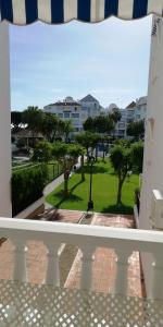 a balcony with a view of a park at Coqueto apartamento a un tiro de piedra de la playa del Portil in El Portil