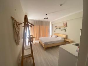 a bedroom with a bed and a ladder in it at Santa Suites- Near Saint Nicholas Church in Demre