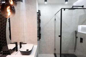 Kúpeľňa v ubytovaní Golden apartmentsIsok15I2 + 1 fotografia