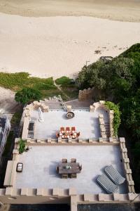 an aerial view of a patio and the beach at Buccara Craighross Castle in Knoetzie