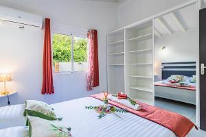 Postel nebo postele na pokoji v ubytování Les Villas de la Cheminée