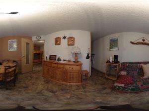 a living room with a couch and a table at Appartement Valloire, 2 pièces, 6 personnes - FR-1-263-497 in Valloire