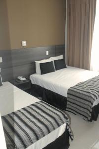 Hotel Atlântico Tower客房内的一张或多张床位