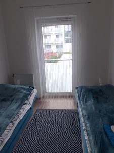 Tempat tidur dalam kamar di Apartament Perła Bałtyku