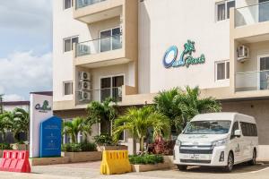 a white van parked in front of a building at OASIS PARK RESIDENCE in East Legon