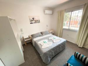 Ένα ή περισσότερα κρεβάτια σε δωμάτιο στο Aguila Blanca +87 φωτογραφίες