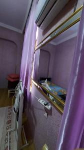 a bedroom with a bunk bed with purple walls at Boutique hotel in Poti +59 photos