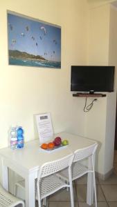 Et tv og/eller underholdning på Residenza Turistico Alberghiera Corallo