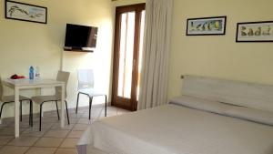 En eller flere senge i et værelse på Residenza Turistico Alberghiera Corallo