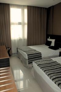 Hotel Atlântico Tower客房内的一张或多张床位