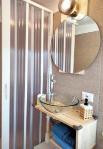 a bathroom with a sink and a mirror at Casa Serena in Castel di Sangro +50 photos