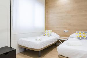 Posteľ alebo postele v izbe v ubytovaní -MalagaSunApts-Central&Cozy 3BDs