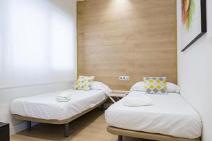 Posteľ alebo postele v izbe v ubytovaní -MalagaSunApts-Central&Cozy 3BDs