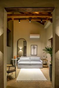 a bedroom with two beds and a large mirror at Privado Selfservice Boutique Rooms in Cartagena de Indias