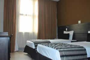 Hotel Atlântico Tower客房内的一张或多张床位