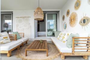 A seating area at LM10BB- Modern ground floor flat in Le Mirage