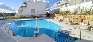 The swimming pool at or close to LM10BB- Modern ground floor flat in Le Mirage