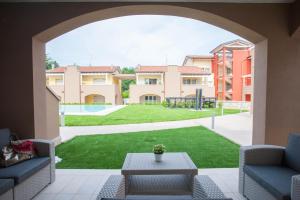 a view of a yard from the patio of a house at Peschiera Terrace in Peschiera del Garda