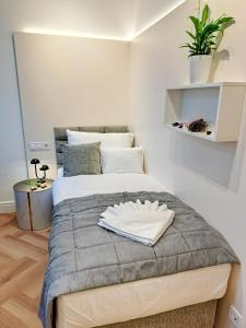 Posteľ alebo postele v izbe v ubytovaní Hotel Domus Collis
