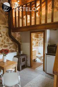 a living room with a wood stove in a house at Casa da Carreirinha in Arcos de Valdevez