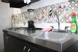 Kuchyň nebo kuchyňský kout v ubytování Aparta Suite Torre De Prado 503 + 25 fotografií