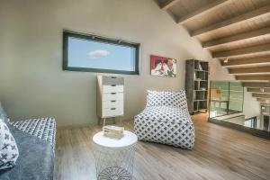 a living room with a couch and a table at Villa Iliotropos in Spathíon