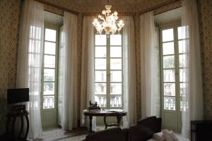 TV a/nebo společenská místnost v ubytování Residenza d'Epoca Regina d'Arborea