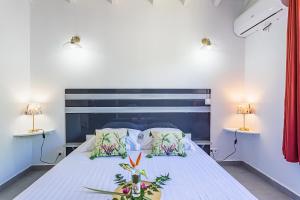 Postel nebo postele na pokoji v ubytování Les Villas de la Cheminée