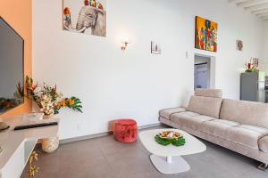 TV a/nebo společenská místnost v ubytování Les Villas de la Cheminée