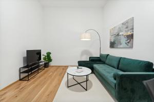 Televízia a/alebo spoločenská miestnosť v ubytovaní Center Wien designer central modern apartment