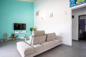 TV a/nebo společenská místnost v ubytování Les Villas de la Cheminée