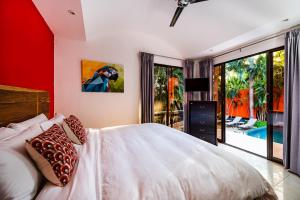 Una cama o camas en una habitación de A Tamarindo Sunset 32 fotos más
