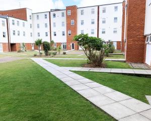 a walkway in front of a brick building at Toothbrush Apartments - Central Ipswich - Nr Train Station in Ipswich