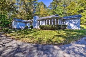 a blue house with a yard in front of it at Charming Central Home Near Golfing and Hiking in Central