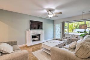 a living room with two couches and a fireplace at Reddington Beach Oasis with Pool, Walk to Ocean! in St. Pete Beach