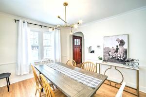 a dining room with a table and chairs at South Bend Home Less Than 1 Mi to Notre Dame! in South Bend