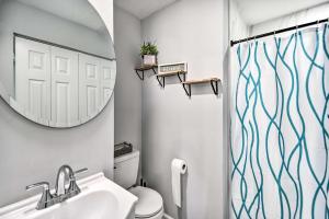 a bathroom with a sink and a mirror at Bright Norfolk Home with Deck Less Than 3 Mi to Town! in Norfolk +21 photos