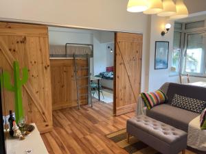 a living room with a couch and a bunk bed at BestHomeStay- Parede Beach (Lisbon) in Parede