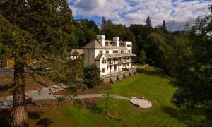 an aerial view of a large house in the woods at Deer Wood at Applethwaite Hall in Windermere