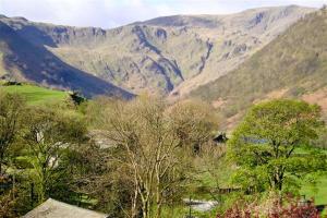 a view of a valley with mountains in the background at Thomas Cottage in Penrith +4 photos