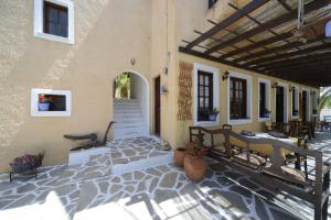 a porch of a house with a patio at Vagia Traditional, Aegina Island in Vaia